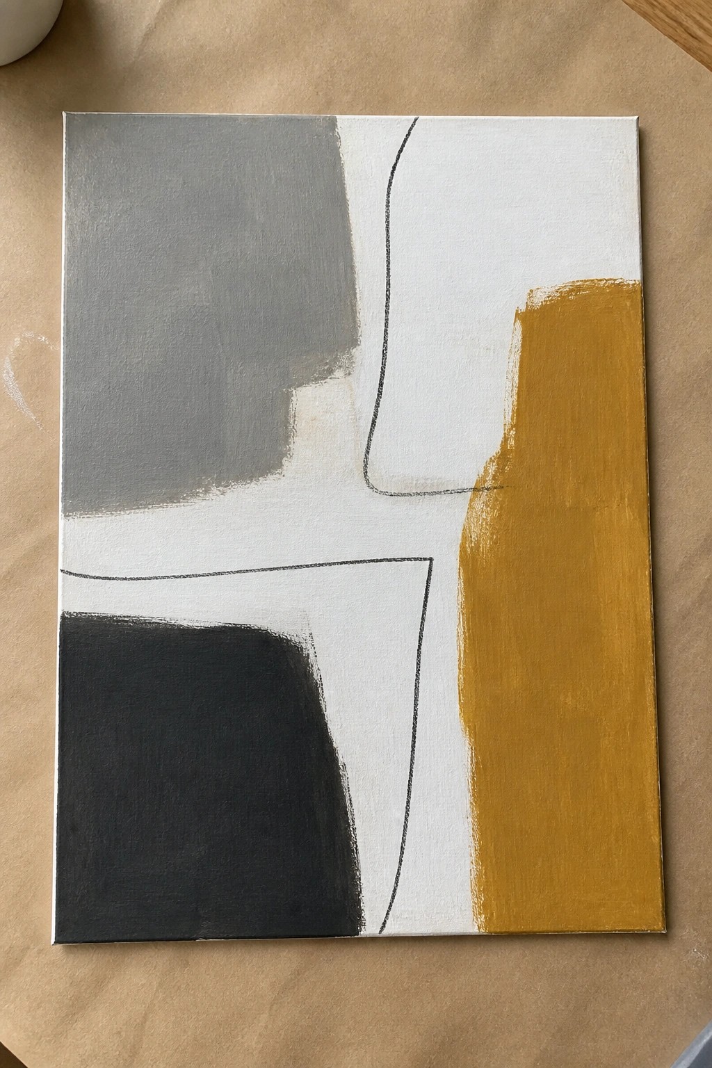 Abstract canvas with gray, black, and mustard-yellow shapes plus curved black lines on white.