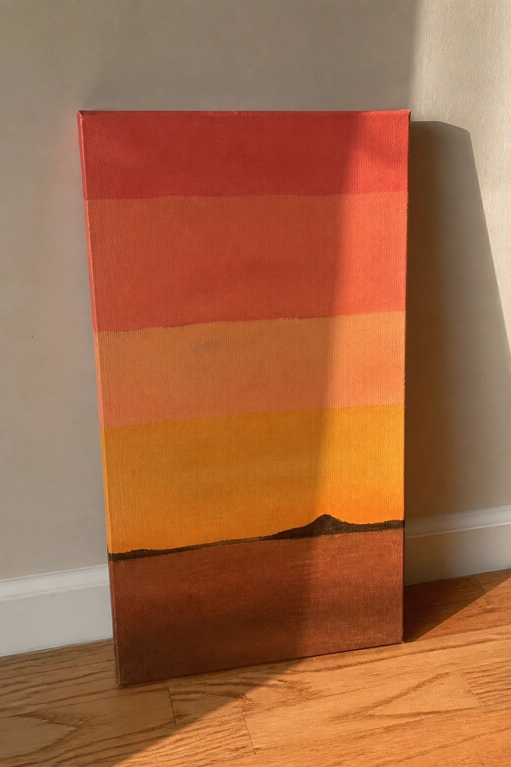 Abstract canvas with red-orange gradient, yellow-brown base, and dark hill silhouette.