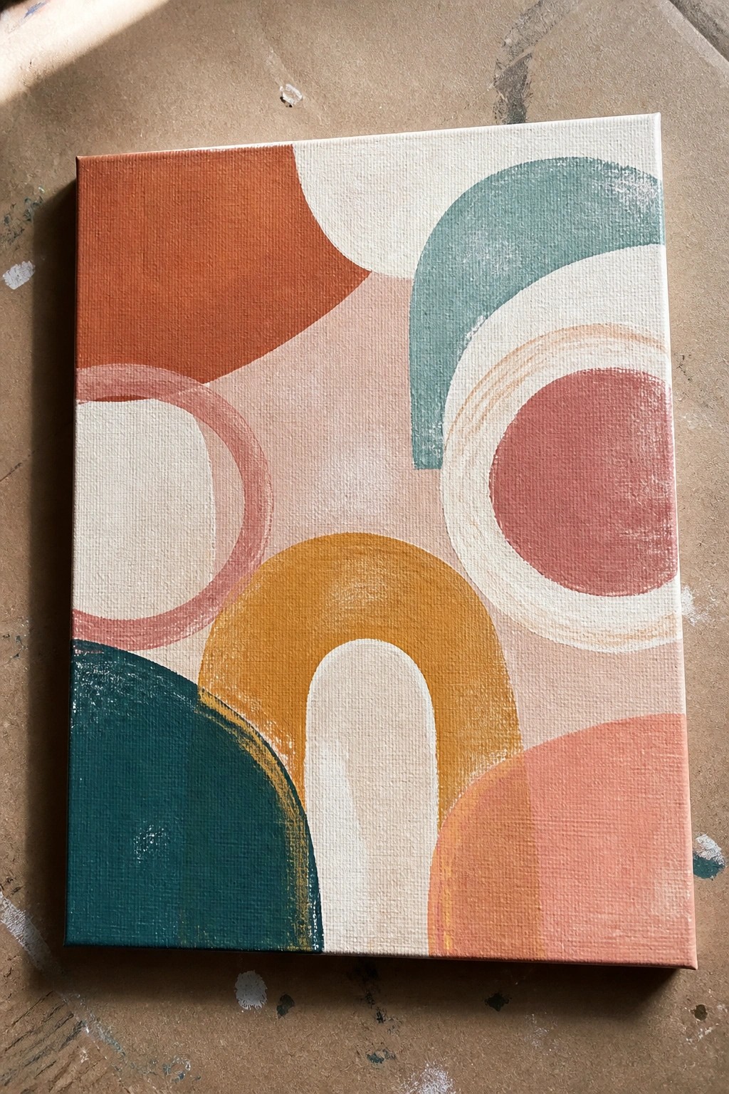 Abstract canvas with overlapping colorful circles, arches in orange, teal, yellow, pink