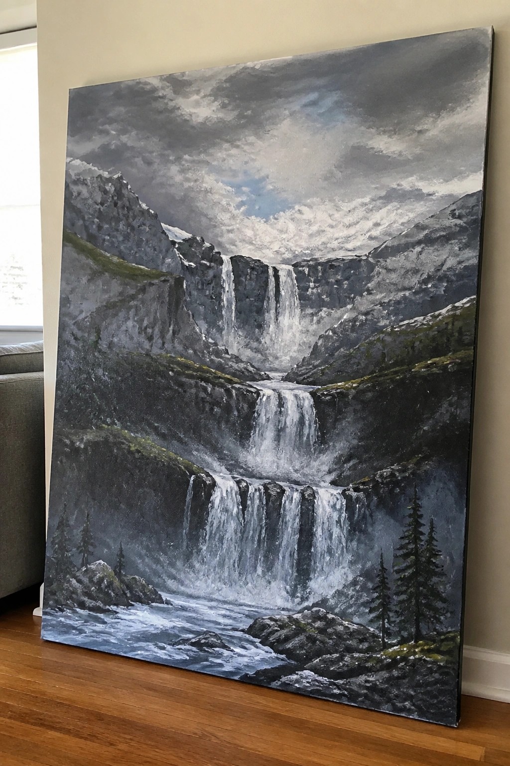 Large realistic painting of cascading waterfalls in a misty rocky mountain valley with pines.