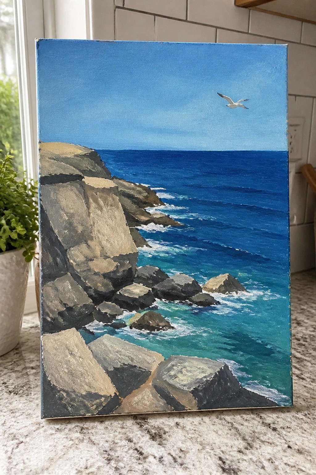 Rocky cliffs meet turquoise waves in blue ocean under clear sky with flying bird.