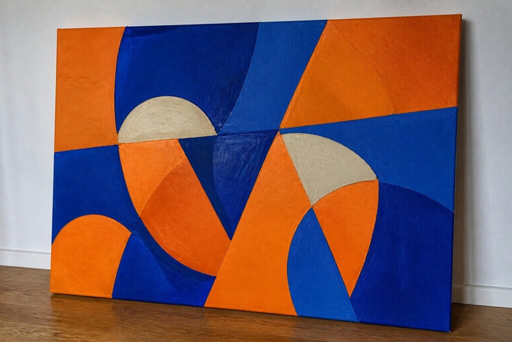 19 Vibrant Abstract Acrylic Painting Ideas in High-Contrast Color Palettes Abstract painting with blue, orange, and white curved shapes on canvas against wall on wood floor