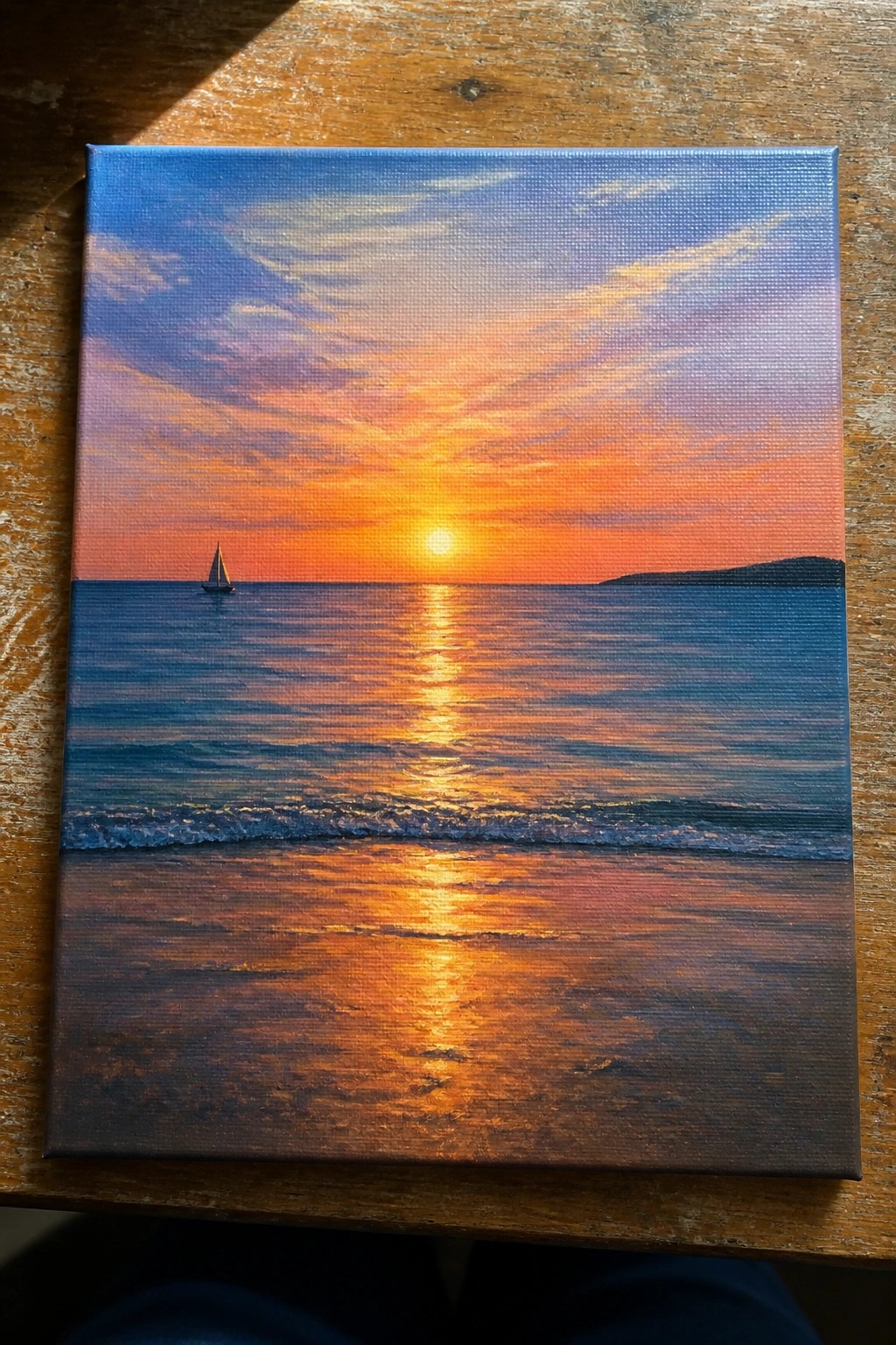 Vibrant sunset painting on canvas with sailboat and golden reflections over ocean waves