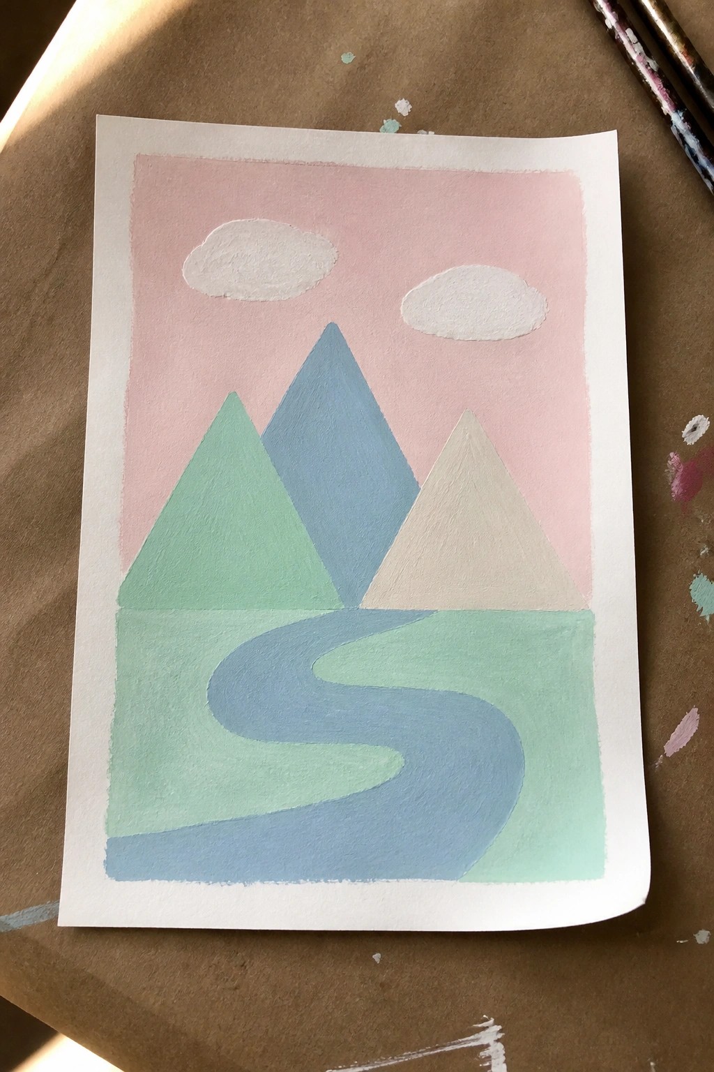 Pastel landscape painting of mountains, winding river, and clouds on pink sky