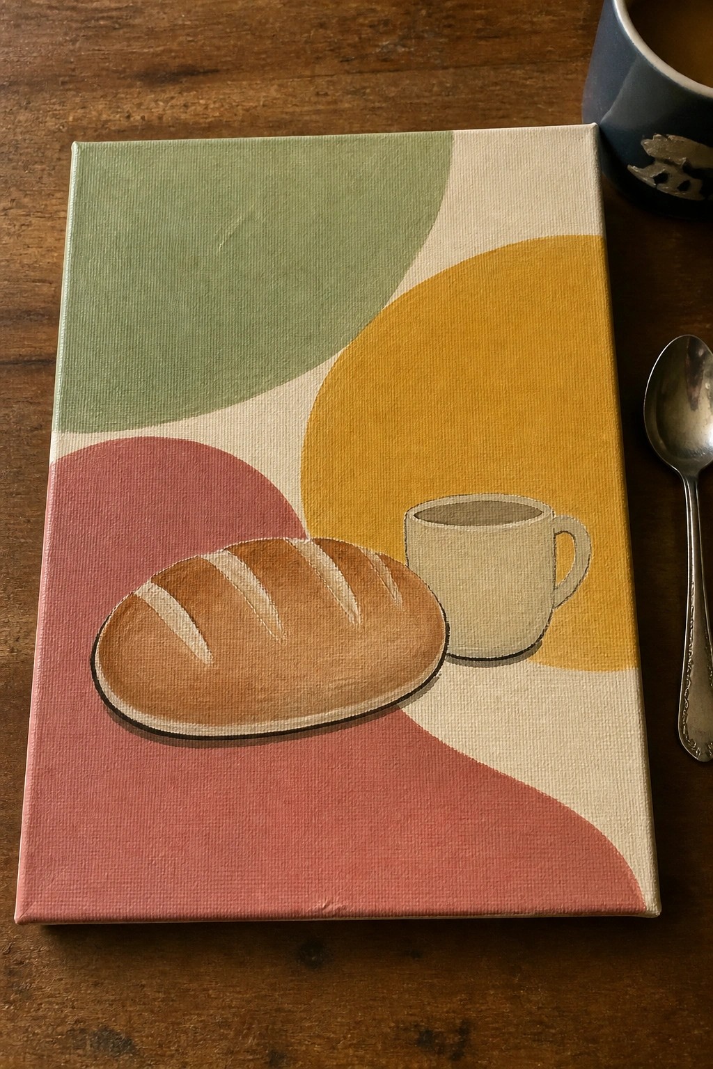 Abstract painting of bread loaf and coffee cup on canvas with colorful shapes