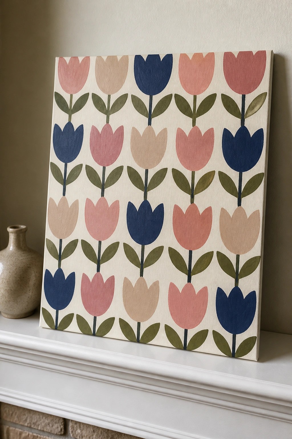 Canvas with rows of pink blue beige tulips on white mantel beside vase
