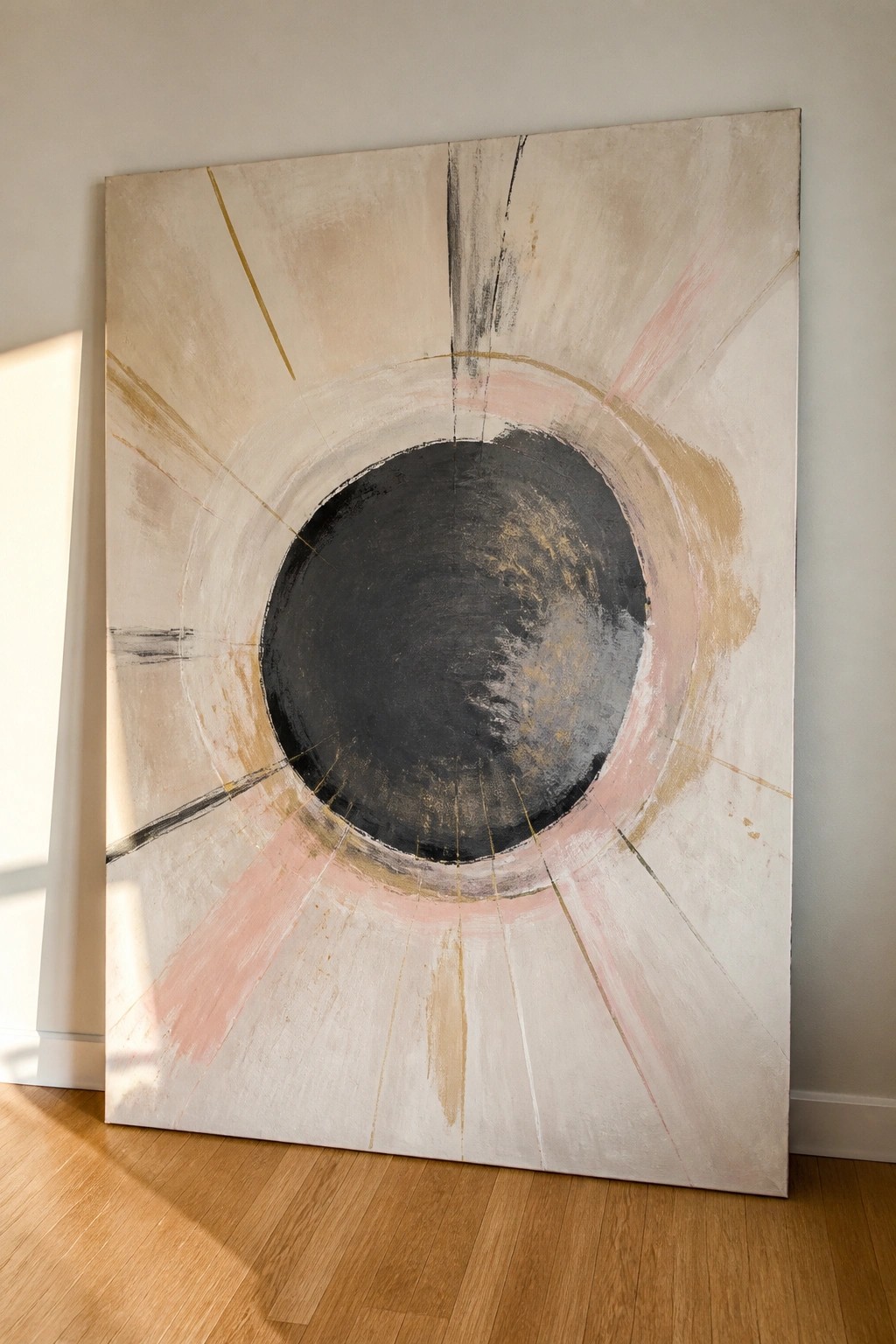 Abstract painting with central black circle and radiating pink gold strokes on beige canvas