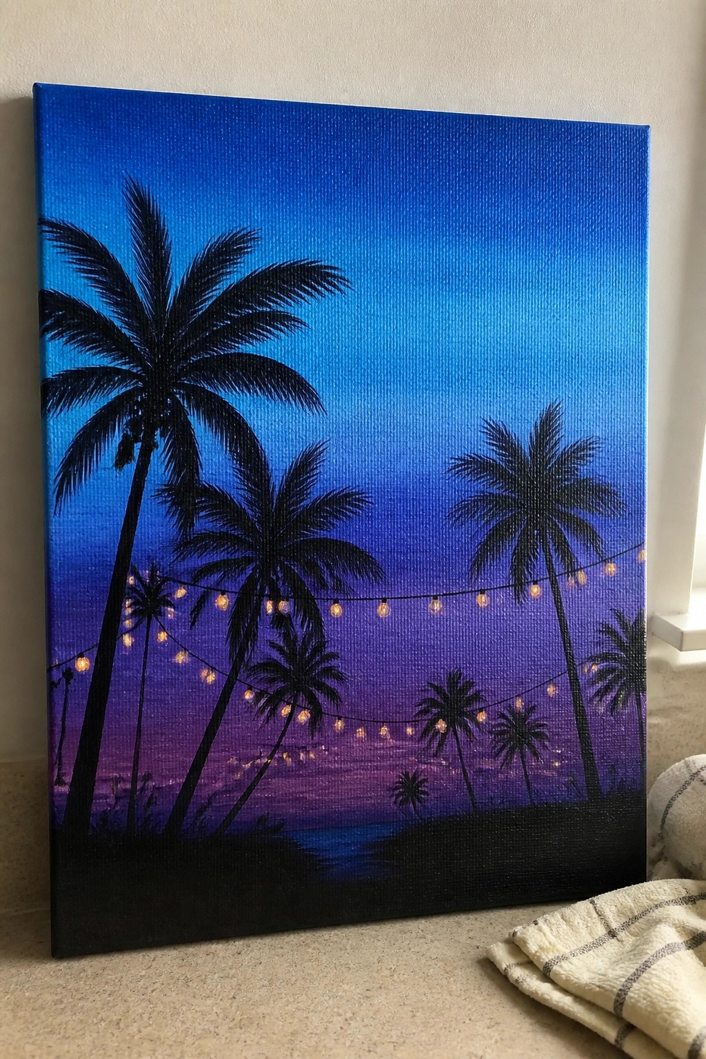 Silhouetted palm trees with glowing string lights against a blue-purple gradient sky on canvas.