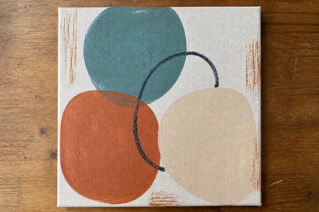 Abstract canvas painting with overlapping teal, orange, and beige circles plus black curve