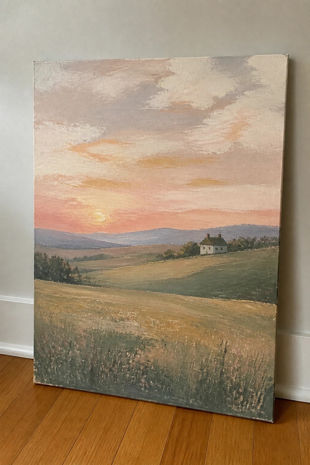 Pastel sunset painting of golden fields, rolling hills, and lone white house.
