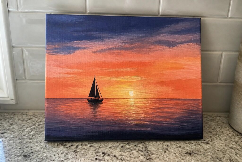 Vibrant sunset painting on canvas with orange sky, reflective sea, and sailboat silhouette