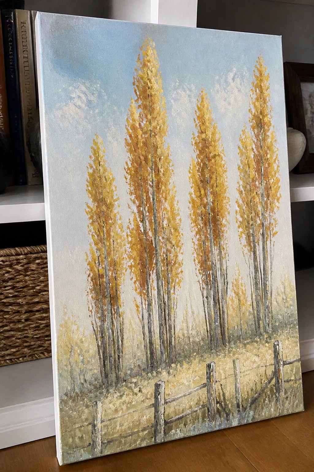 Canvas painting of tall golden trees and wooden fence under blue sky