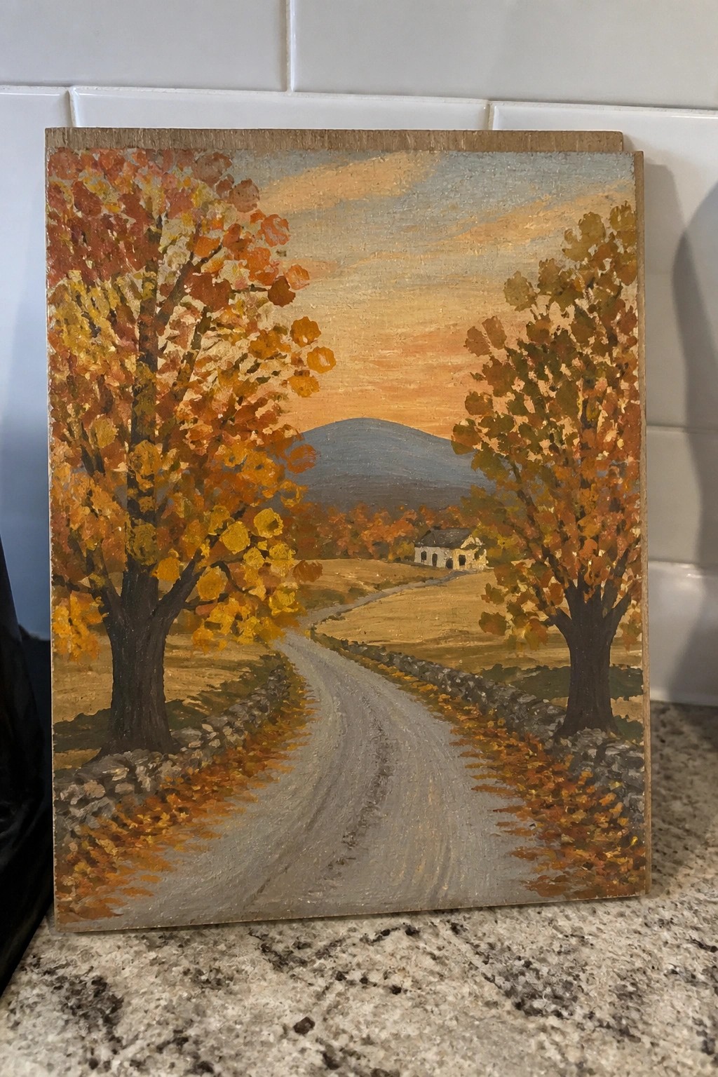 Autumn painting of winding road flanked by orange trees, stone walls, distant house.