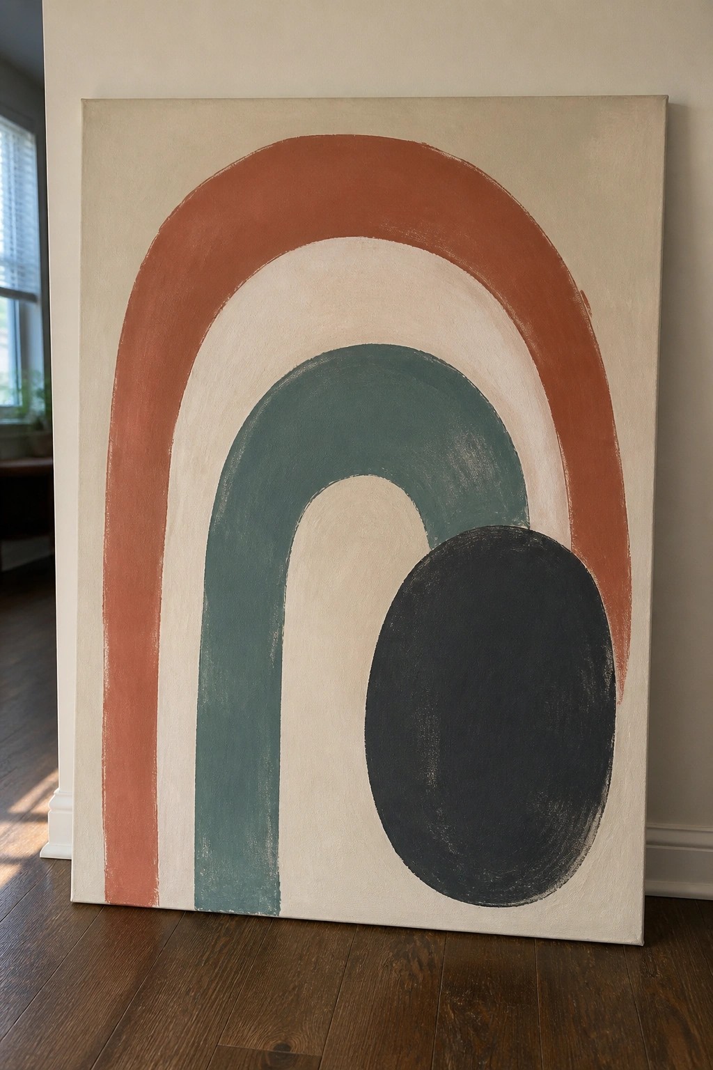 Abstract painting with terracotta arches, teal curve, and black oval on beige canvas