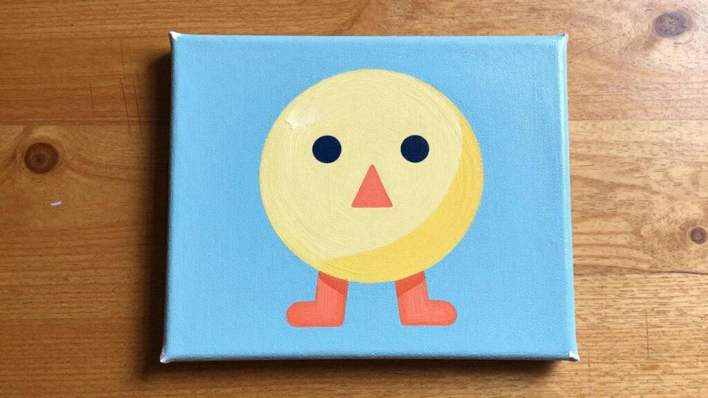 Yellow smiley face painting with orange arms, legs, and crescent on light blue canvas