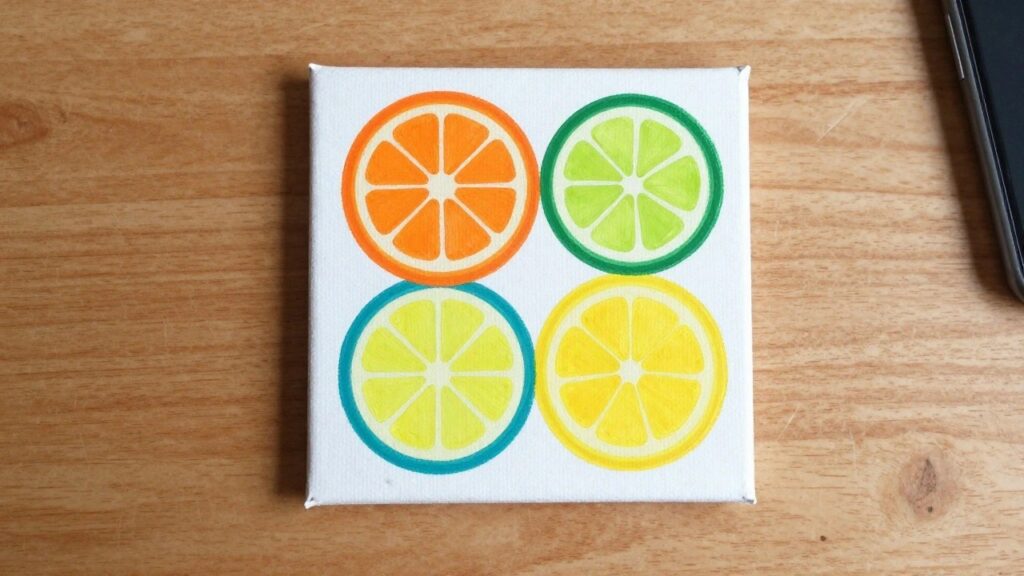 Acrylic painting of orange slice, whole lemon, and lime wedge on light blue canvas.