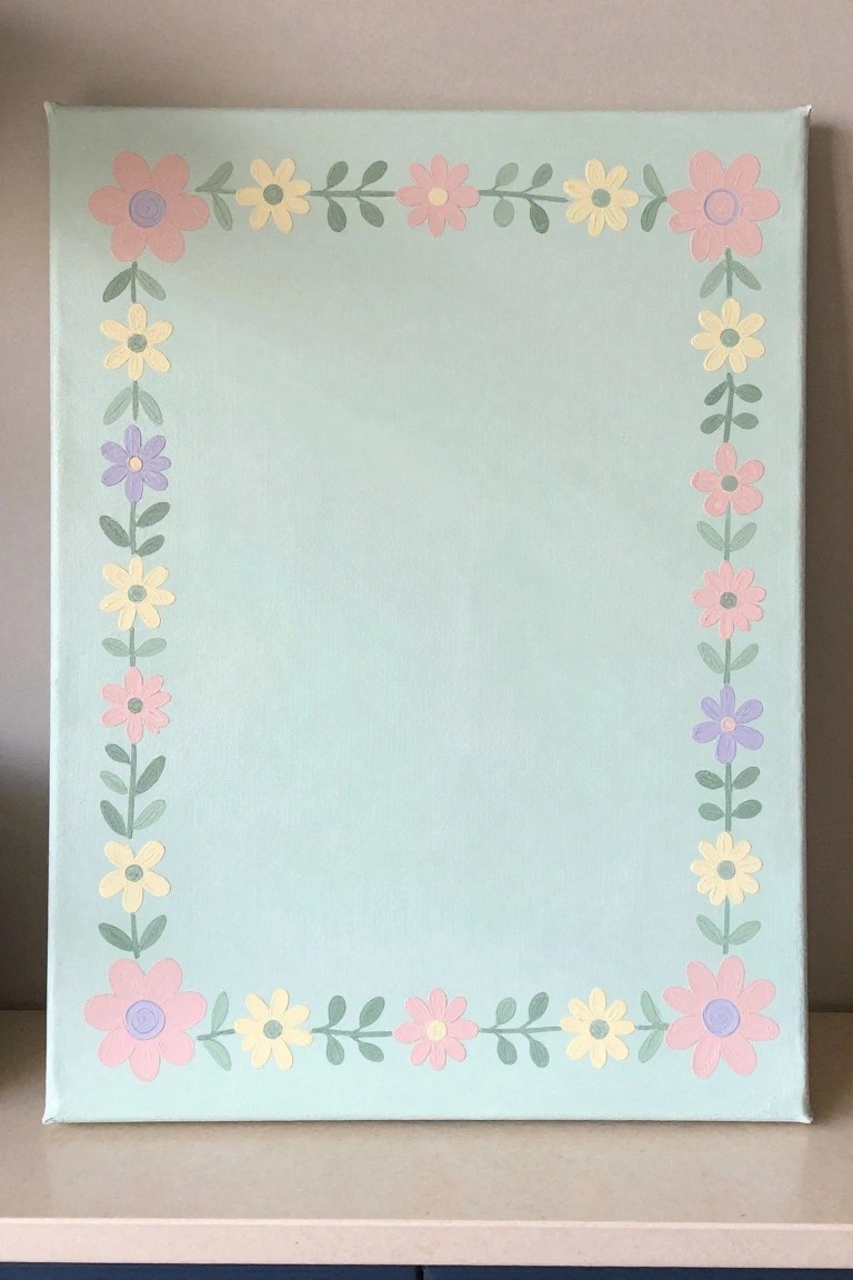 Light mint canvas with border of pink yellow purple painted flowers