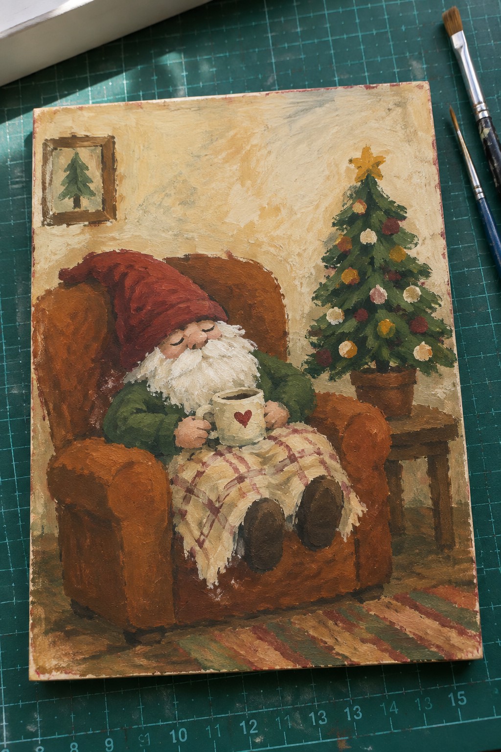 Bearded gnome in red hat naps in armchair holding heart mug near Christmas tree