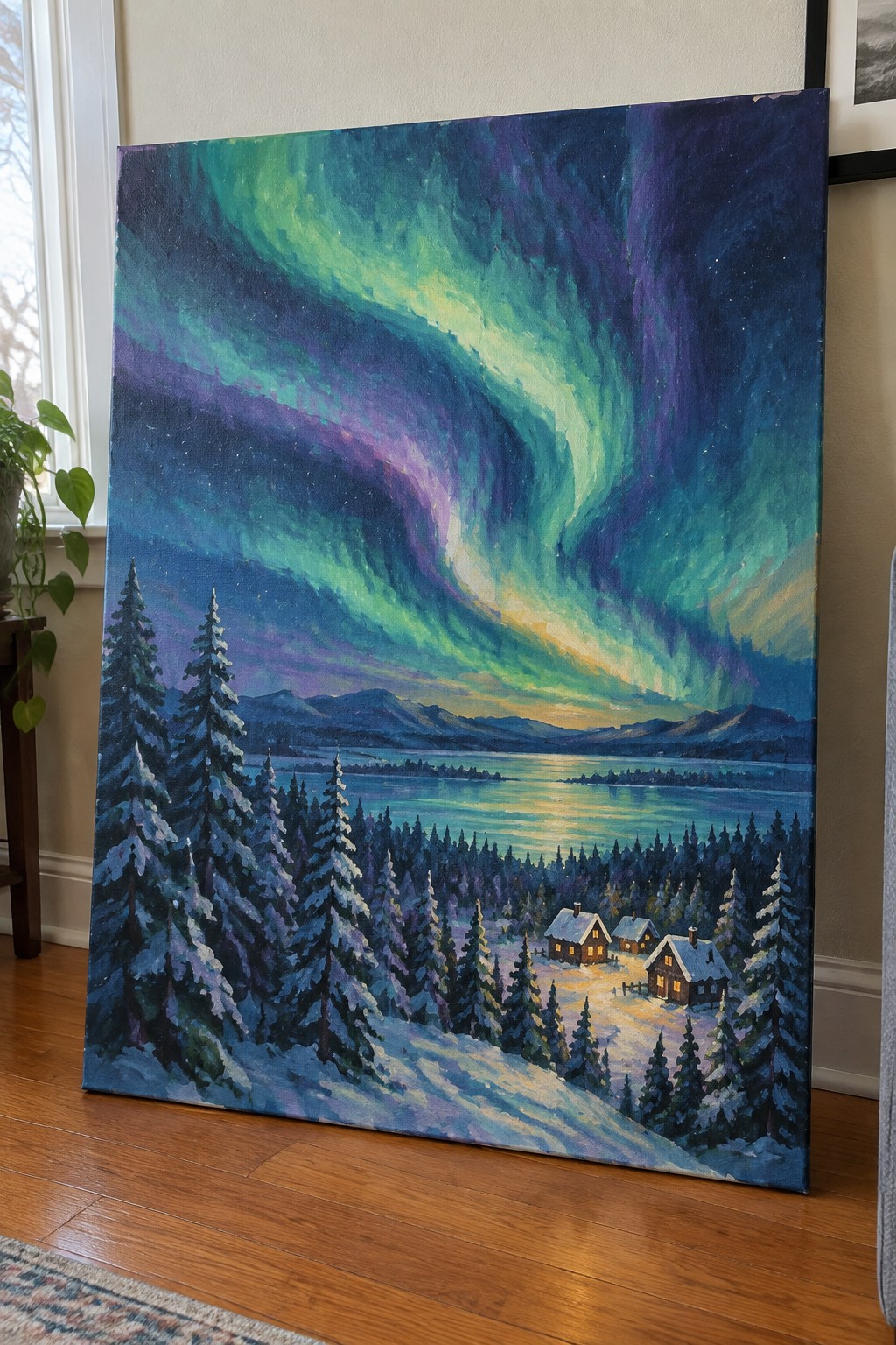 Swirling green-purple aurora over snowy pines, glowing cabins, and reflective mountain lake