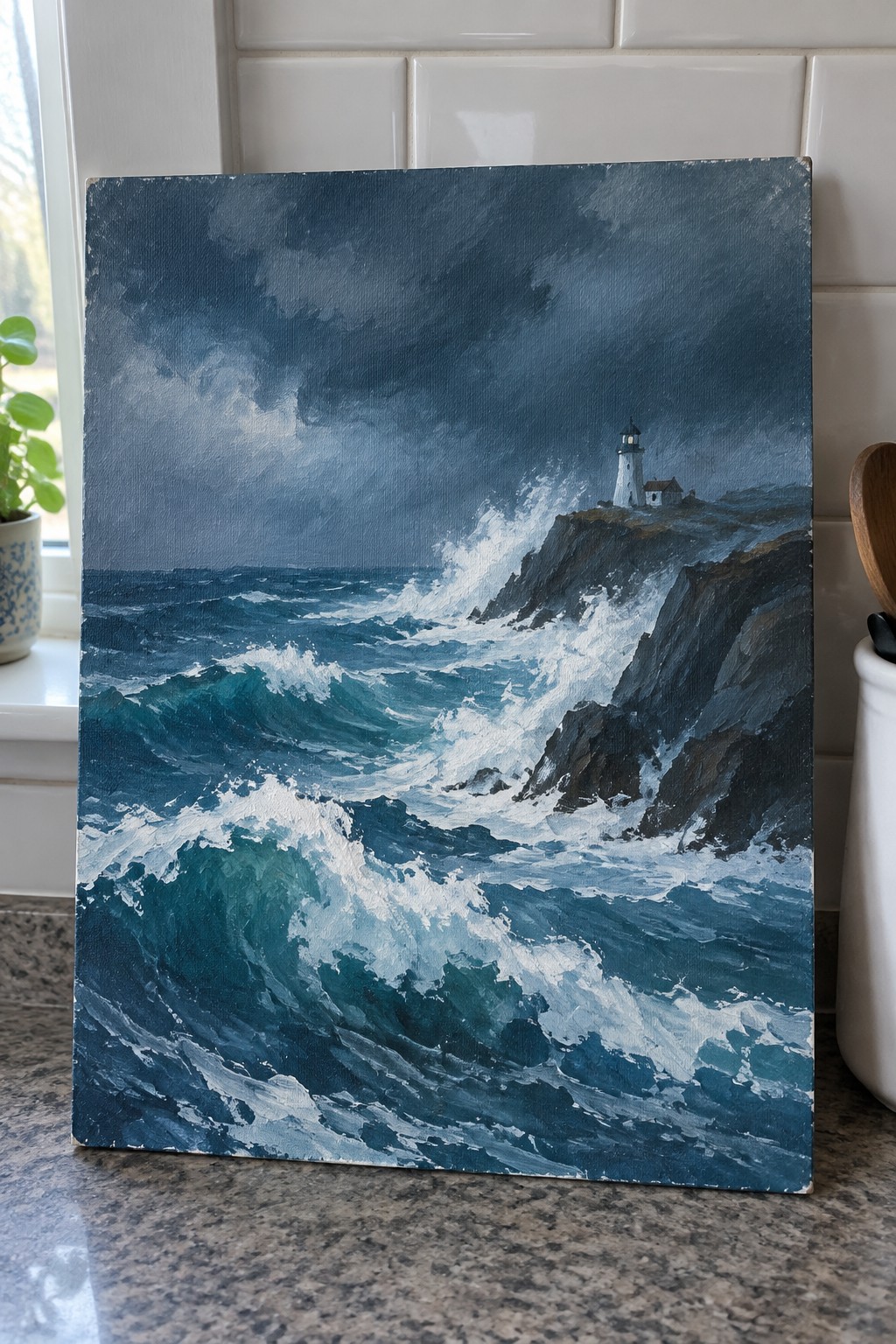 Stormy seascape painting shows crashing turquoise waves on dark cliffs with white lighthouse.
