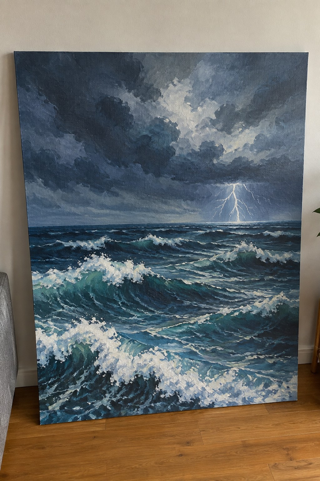 Large acrylic painting of a stormy ocean with dark clouds, crashing blue-green waves with white foam, and a bright lightning bolt striking the water in the distance.