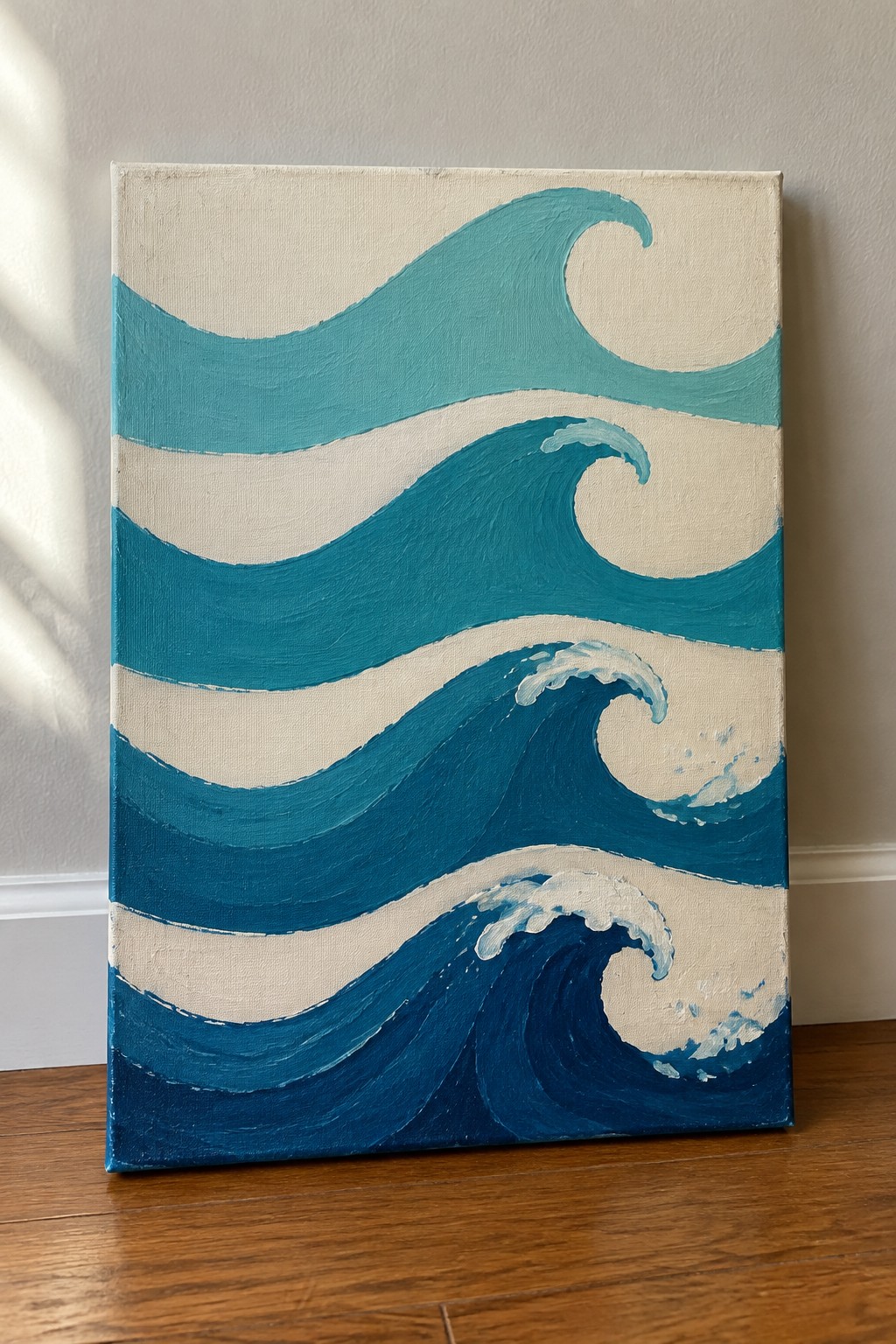 Stylized blue ocean waves with white foam painted on canvas against wall