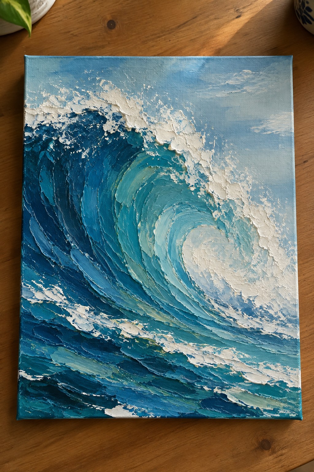 Textured impasto painting of a curling blue ocean wave with white foam.
