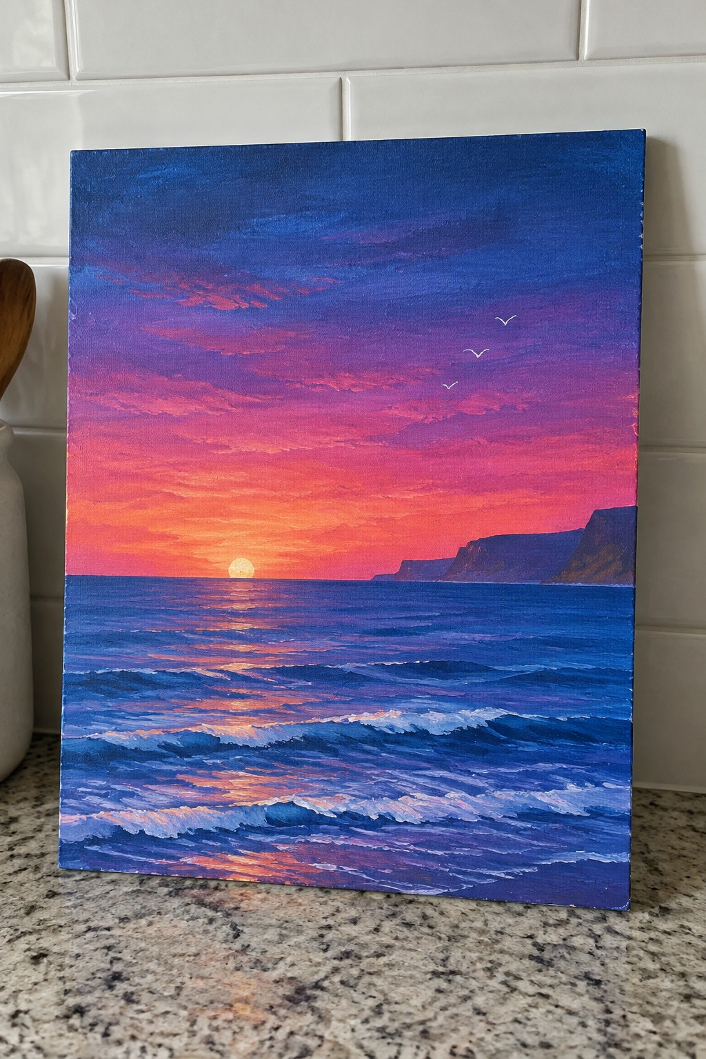 Vivid sunset seascape painting with purple-pink sky, ocean waves, cliffs, and birds