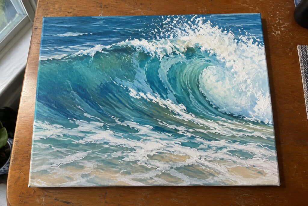 Painting of curling teal wave with white foam on wooden table beside plant