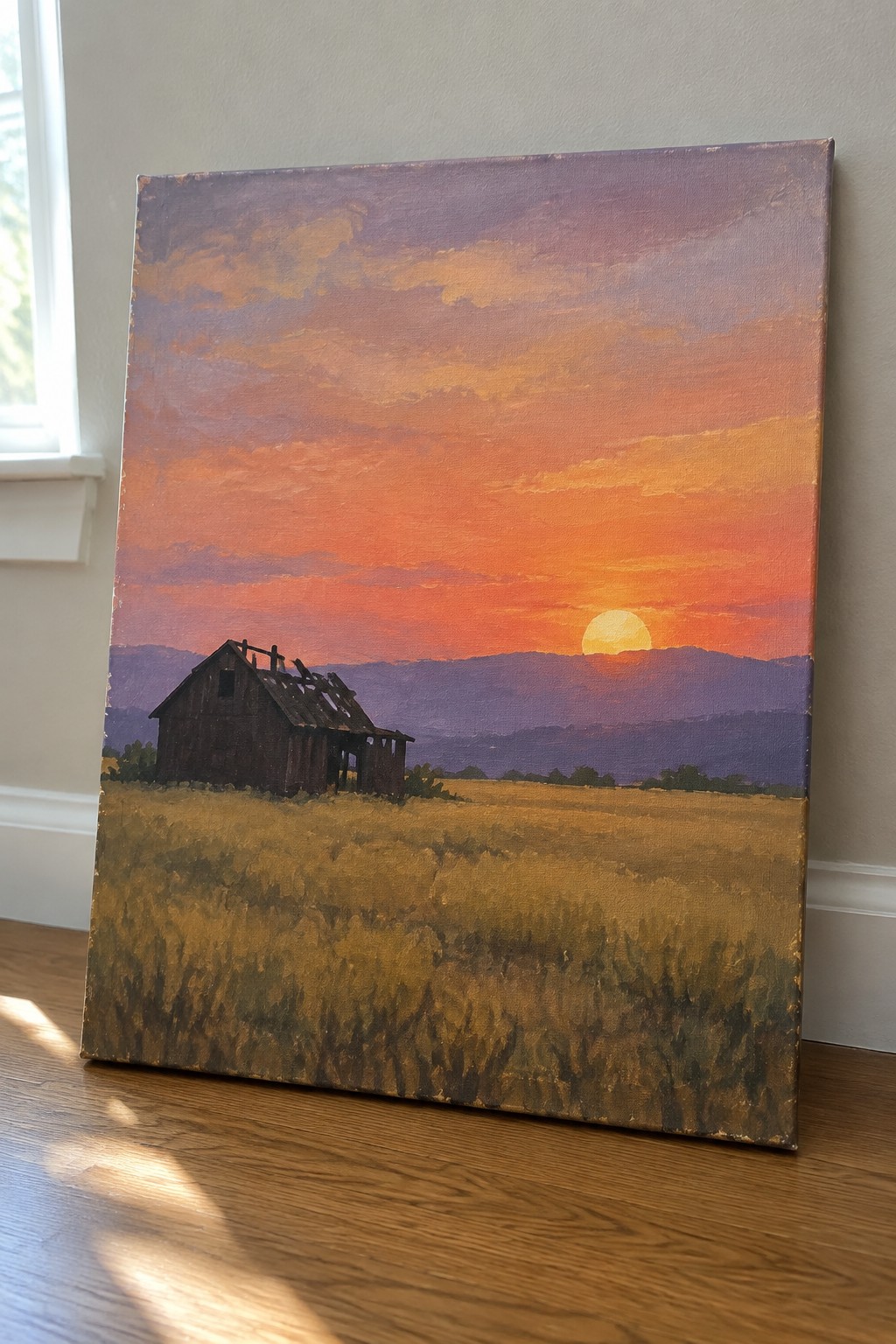 Sunset painting of dilapidated barn in golden field with purple mountains and orange sky