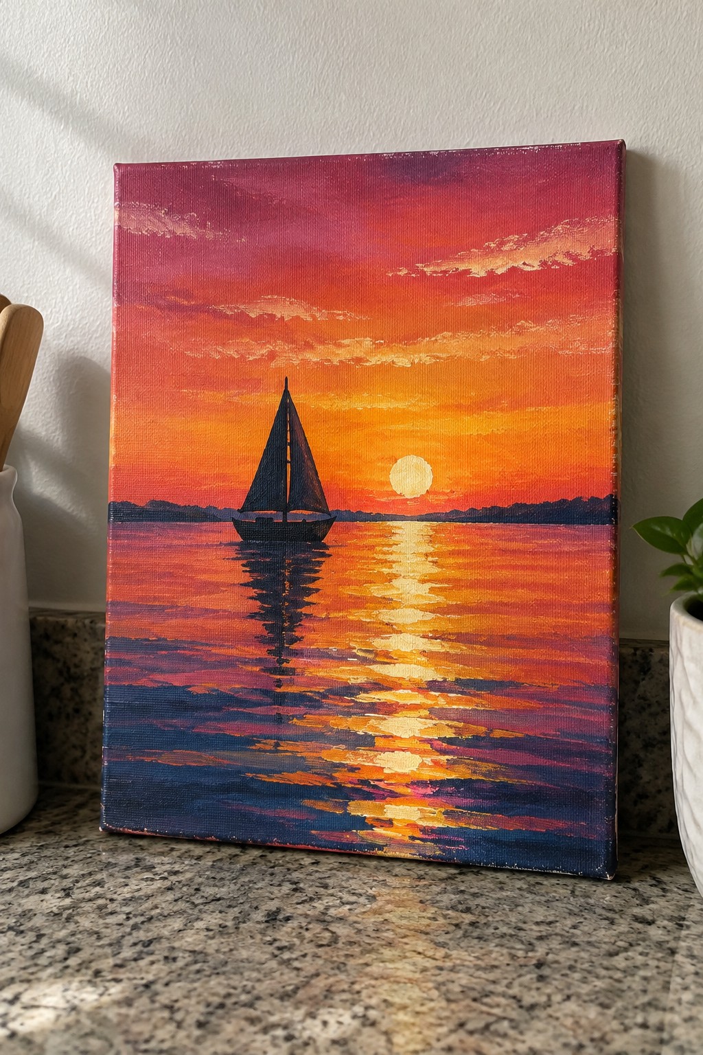 Vibrant canvas painting of sailboat silhouette on reflective water under red-orange sunset sky.