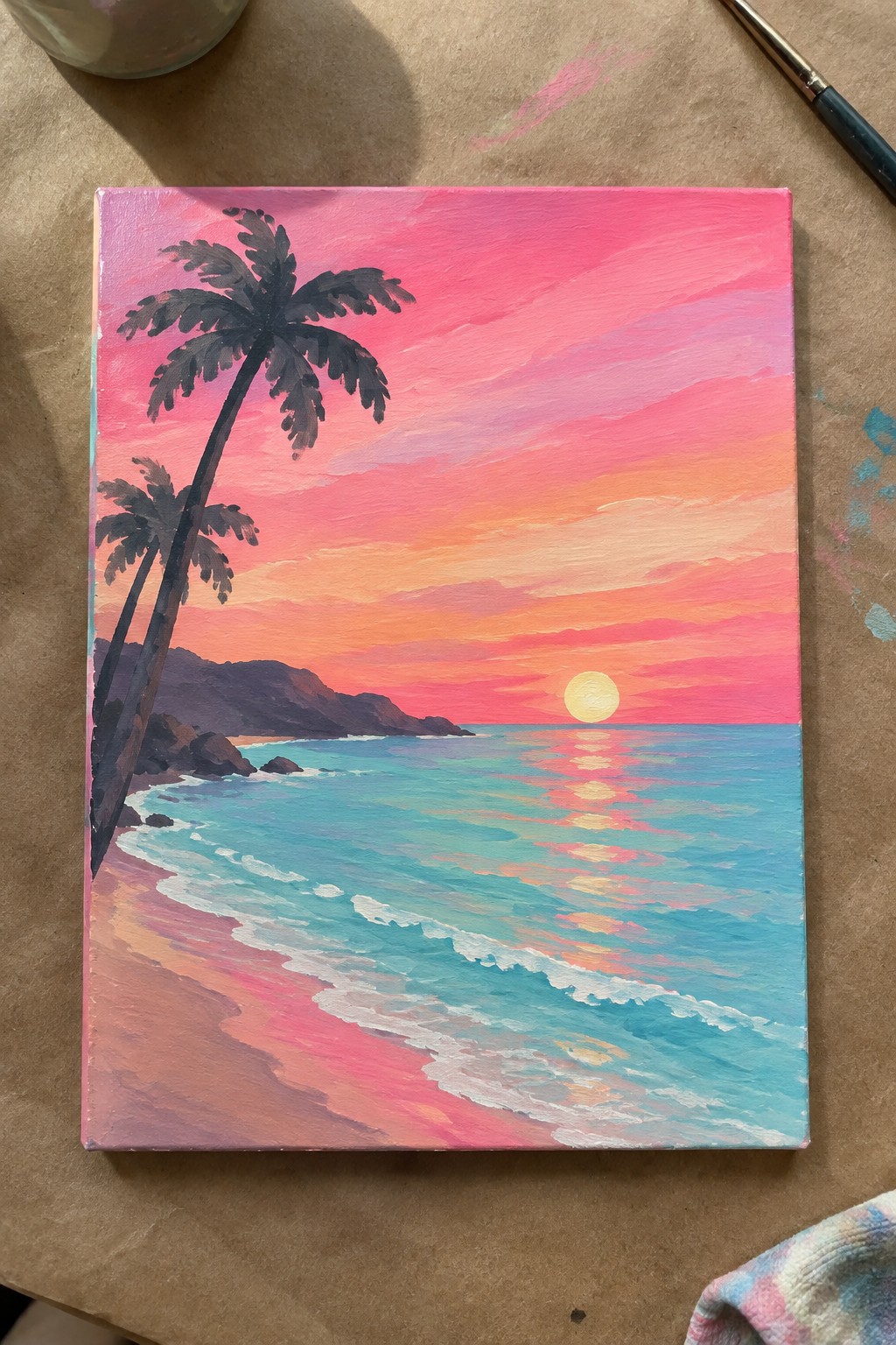 Vibrant acrylic sunset painting with palm trees, pink sky, turquoise waves, and sun