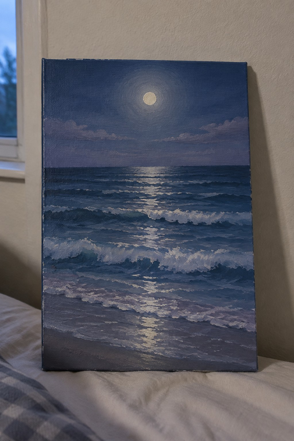 Moonlit ocean painting with full moon reflecting on dark blue waves at night