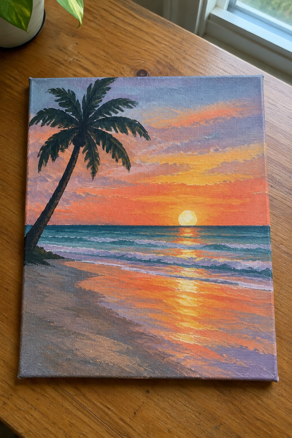 Canvas painting of palm tree on beach at vibrant orange-purple ocean sunset