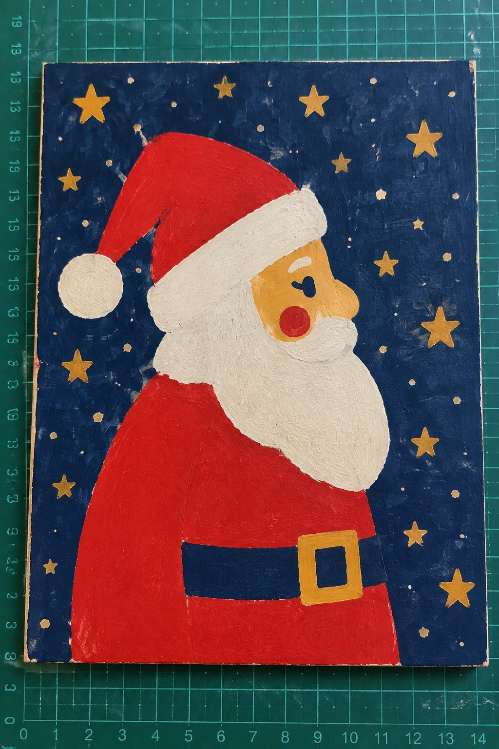 Folk art painting of Santa Claus in profile with red suit and starry blue sky