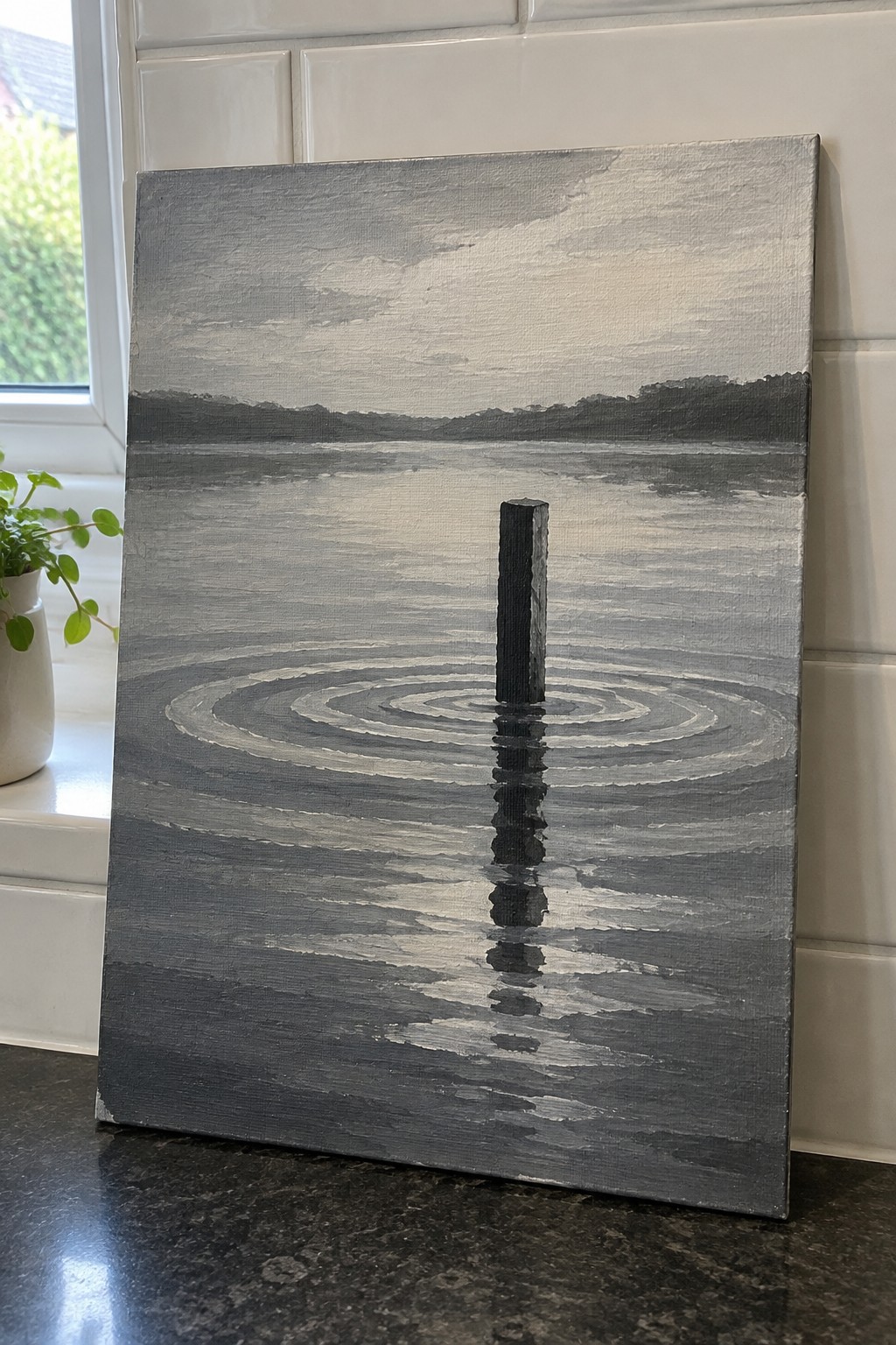 Grayscale painting of a dark post in rippled water with shoreline reflection