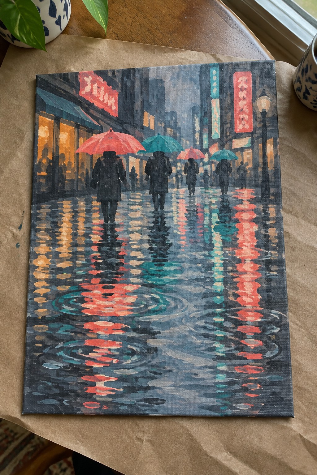 Painting of rainy night city street with people in dark coats holding red and teal umbrellas.