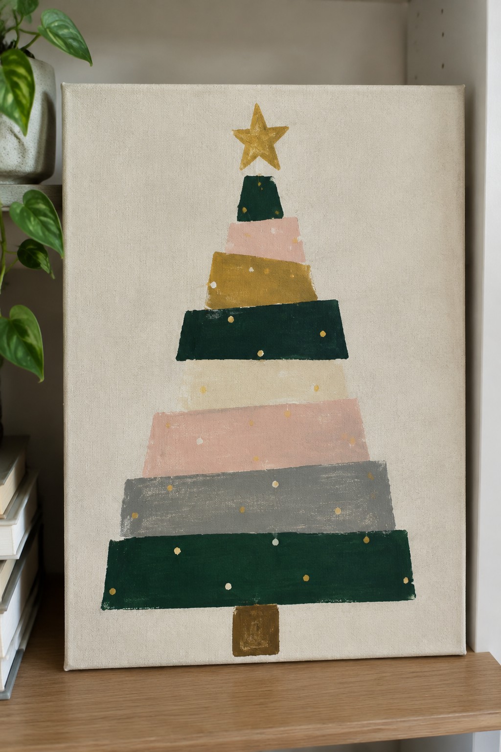 Abstract Christmas tree painting with layered green, pink, gold shapes, star, and dots on canvas