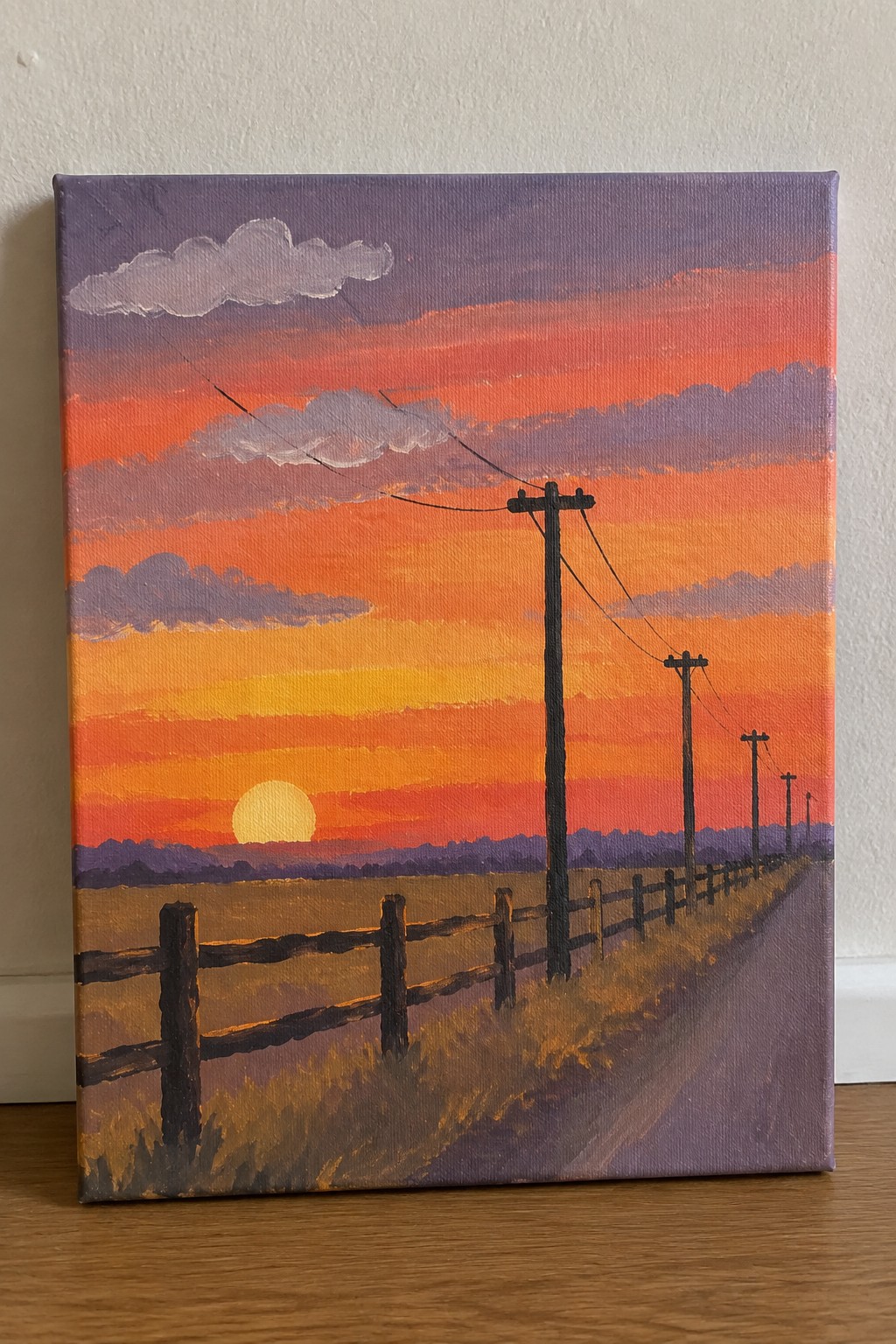 Vibrant acrylic sunset painting with wooden fence, utility poles, and orange-purple sky.