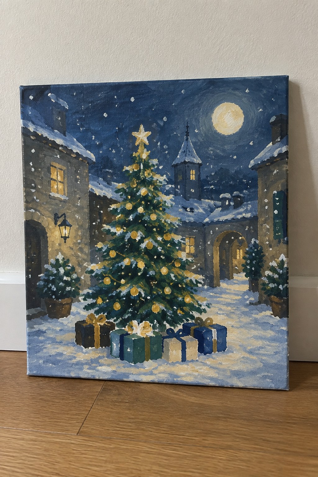 Snowy Christmas tree with gifts under full moon amid snow-covered village buildings at night