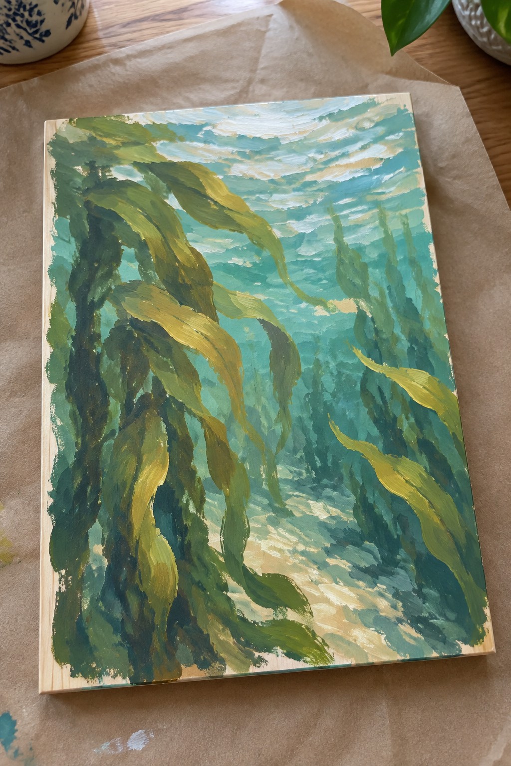 Vibrant painting of swaying green kelp in sunlit blue-green ocean waters