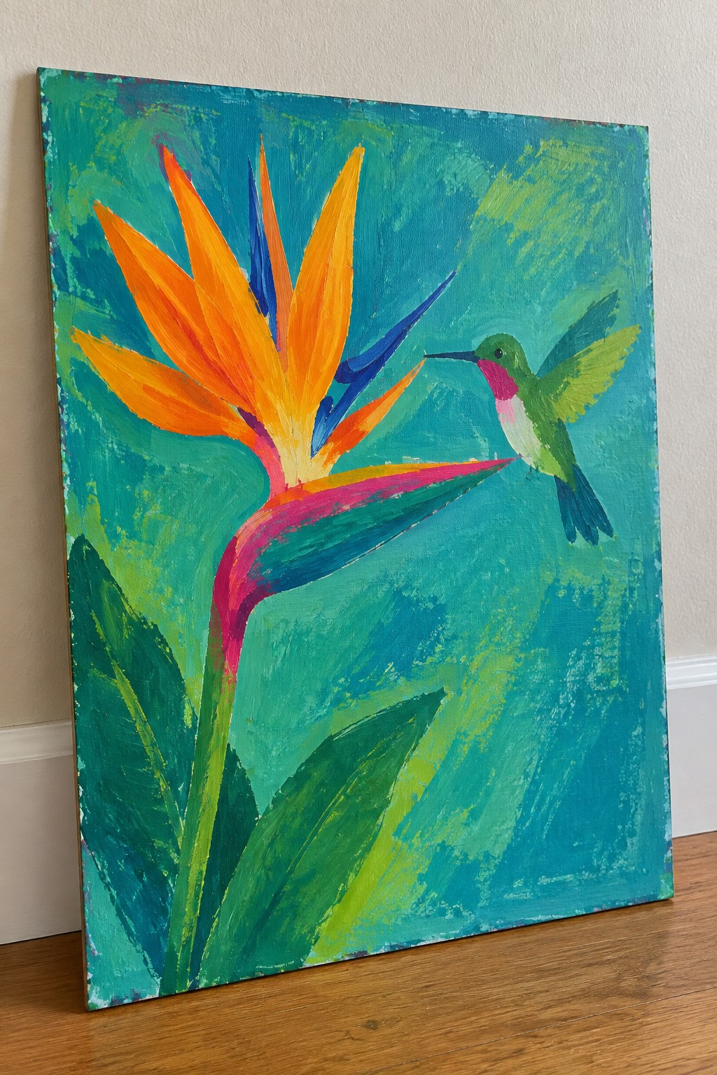 Vibrant painting of orange bird of paradise flower with green hummingbird on teal background