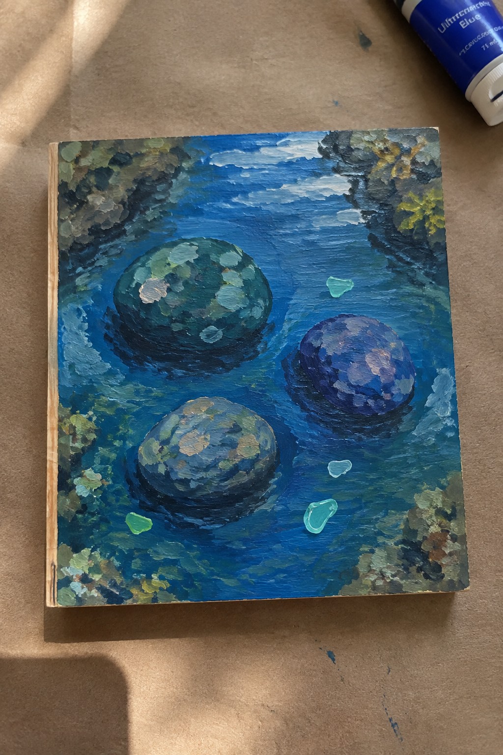 Impressionistic painting of three textured orbs floating in blue water with green foliage